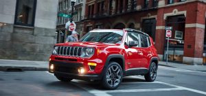 Red 2021 Jeep Renegade Driving Down a Street